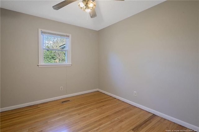 unfurnished room with ceiling fan and light hardwood / wood-style flooring