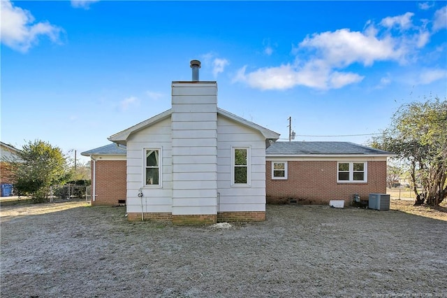 back of property featuring central AC