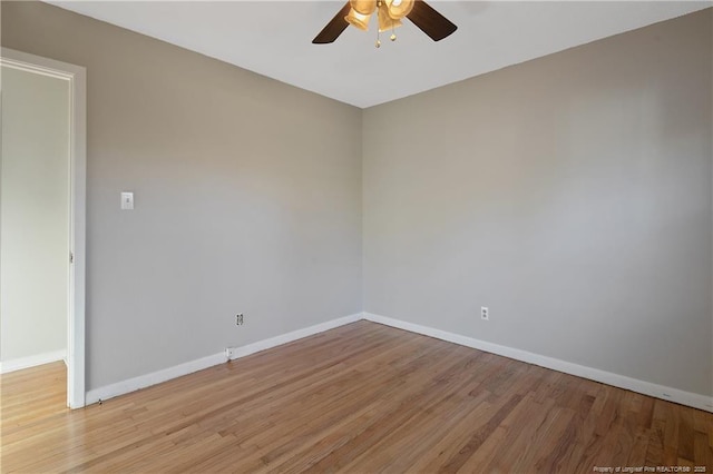 empty room with light hardwood / wood-style floors and ceiling fan