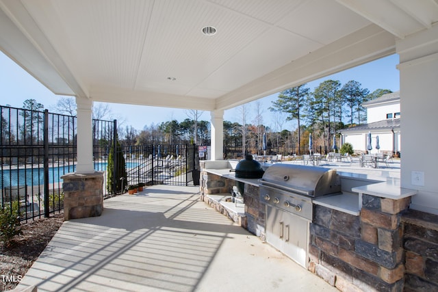 view of patio featuring grilling area and exterior kitchen