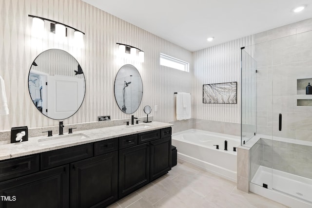 bathroom with vanity, independent shower and bath, and tile patterned flooring