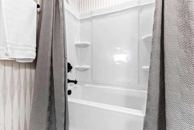 bathroom with shower / bath combination with curtain