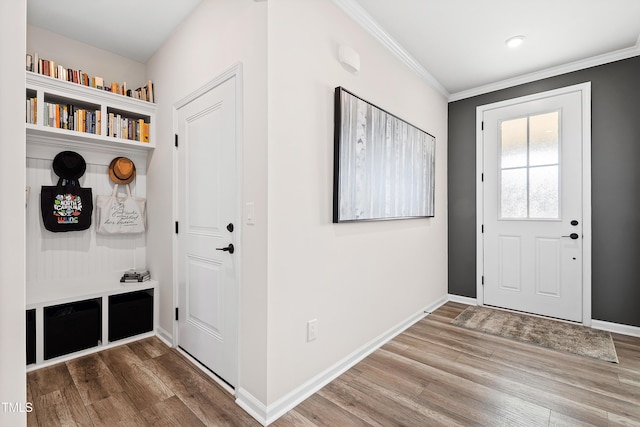 mudroom with hardwood / wood-style flooring and crown molding