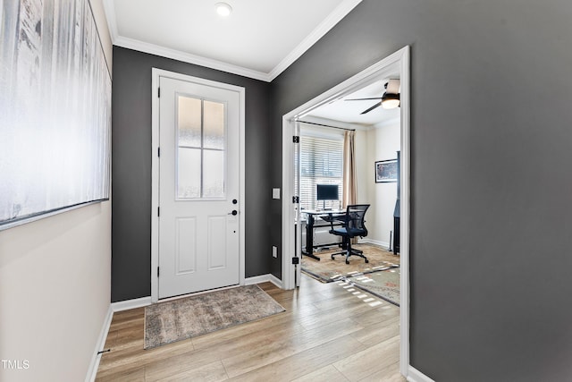 foyer with crown molding, ceiling fan, and light hardwood / wood-style flooring