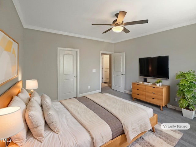 carpeted bedroom with ceiling fan and crown molding