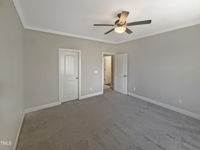 unfurnished bedroom featuring carpet flooring, ceiling fan, and crown molding