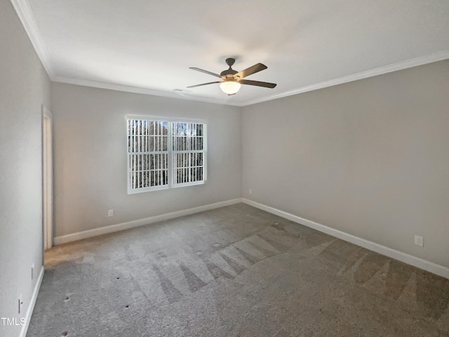 carpeted empty room featuring crown molding and ceiling fan