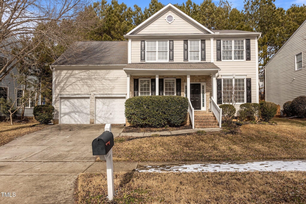 view of front of home with a garage and covered porch