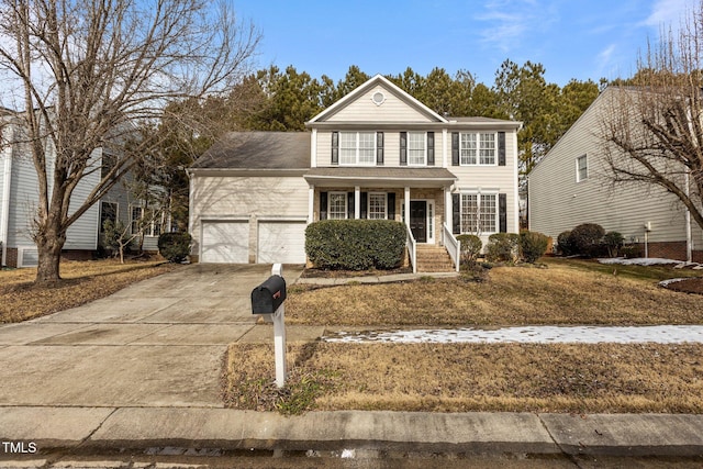 view of front of home featuring a porch and a garage