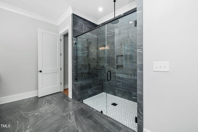 bathroom featuring an enclosed shower and ornamental molding