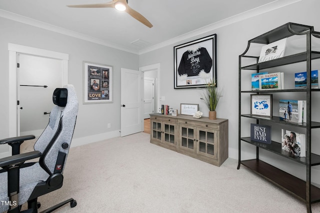 carpeted office with ornamental molding and ceiling fan