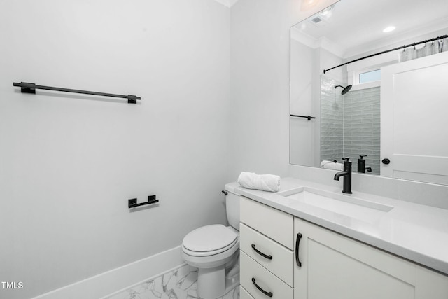 bathroom featuring vanity, tiled shower, and toilet