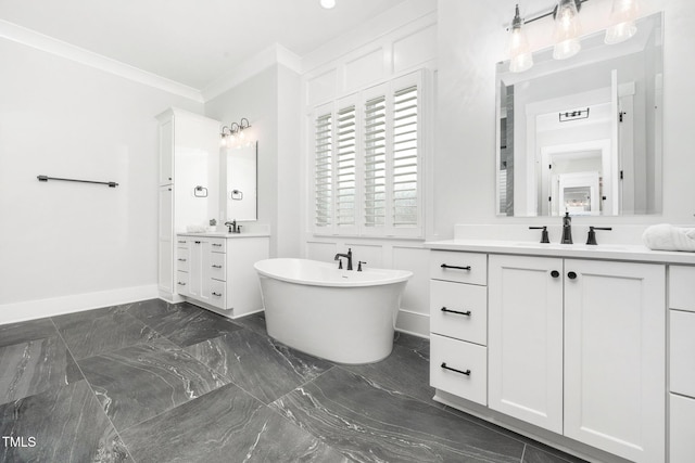 bathroom with crown molding, a tub, and vanity