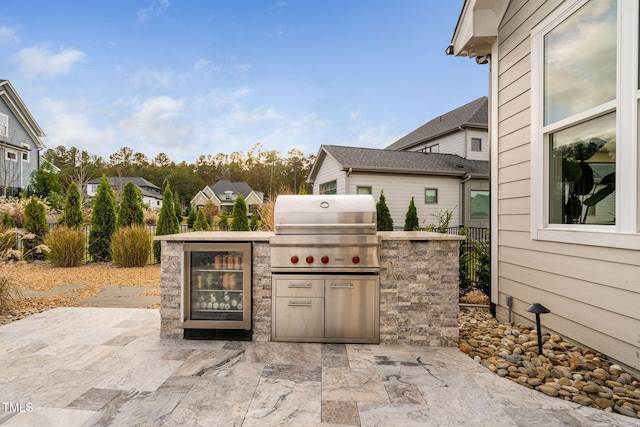 view of patio featuring area for grilling and exterior kitchen