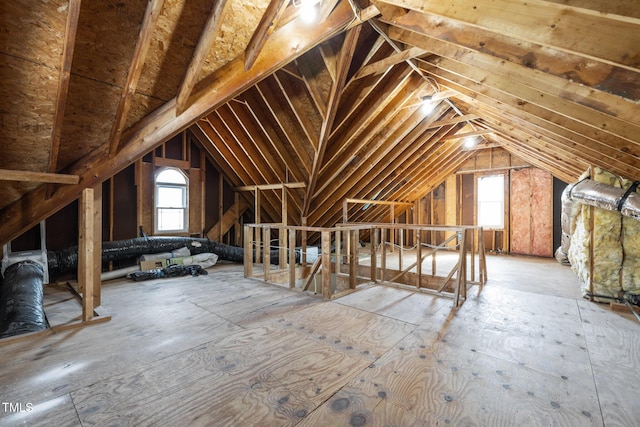 attic featuring an upstairs landing