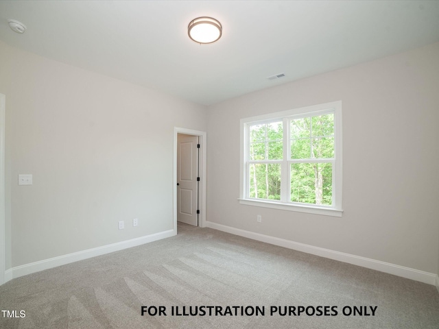 carpeted empty room featuring visible vents and baseboards