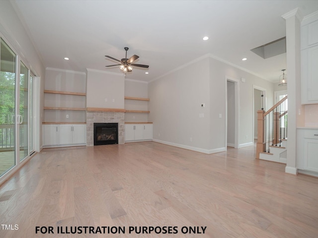 unfurnished living room featuring a tiled fireplace, plenty of natural light, baseboards, and light wood-style floors