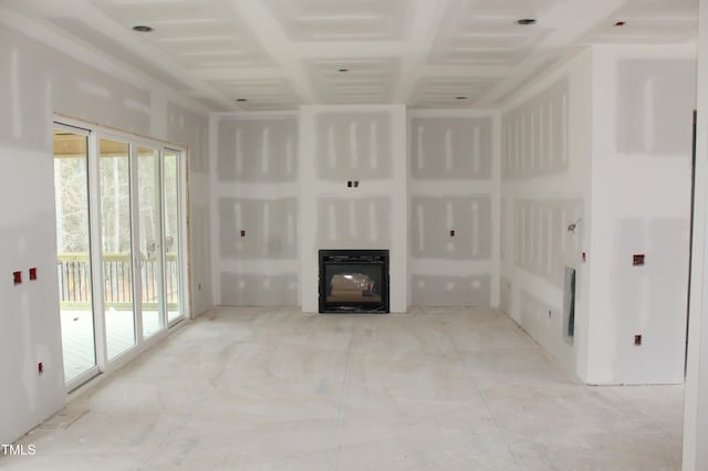 unfurnished living room with a glass covered fireplace