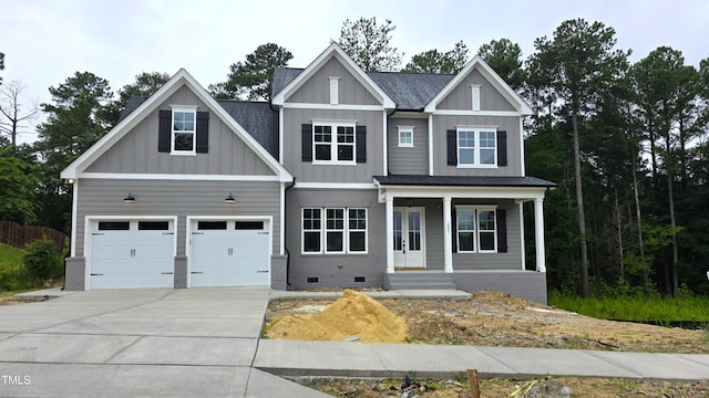1021 Smoke Willow Way Unit 130, Rolesville, NC 27571 - view of front of house with driveway, board and batten siding, covered porch, and crawl space