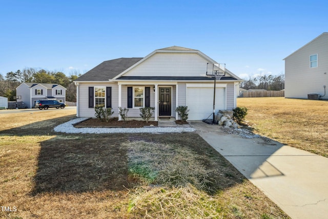 view of front facade with central AC unit, a front lawn, and a garage