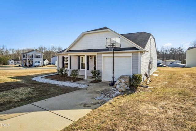 view of front of house featuring a garage and a front lawn