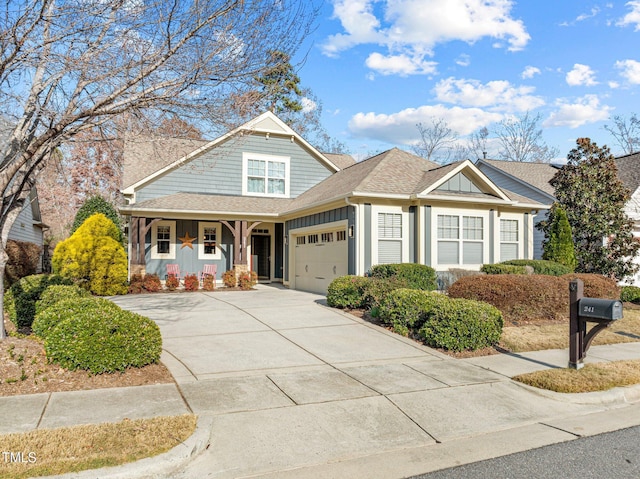 view of front of home featuring covered porch and a garage