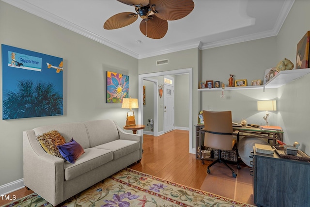 office area with ceiling fan, ornamental molding, and hardwood / wood-style floors