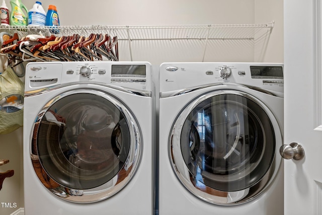 laundry room featuring washing machine and dryer