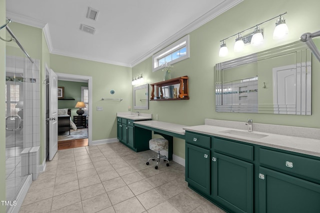 bathroom featuring ornamental molding, walk in shower, vanity, and tile patterned floors