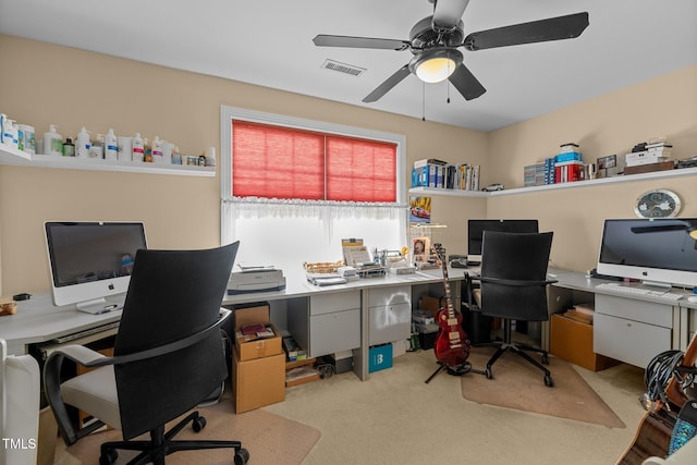 office with light carpet and ceiling fan