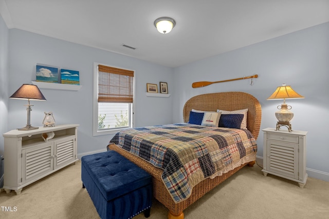 bedroom featuring light colored carpet