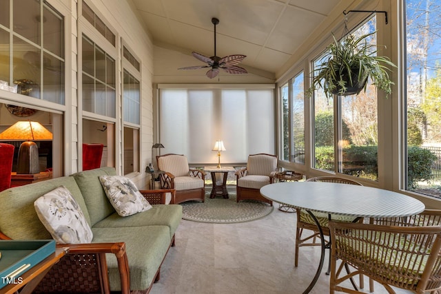 sunroom with ceiling fan