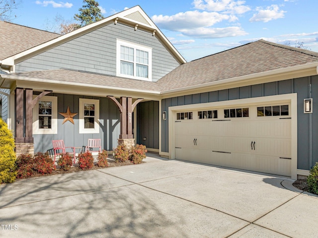 view of front of house featuring a porch and a garage