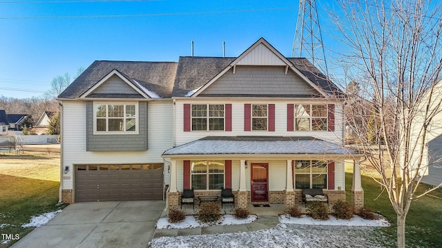 craftsman-style home featuring covered porch and a garage