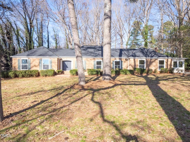 ranch-style house with a front yard