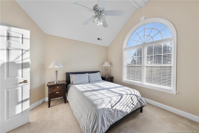 carpeted bedroom featuring ceiling fan and vaulted ceiling