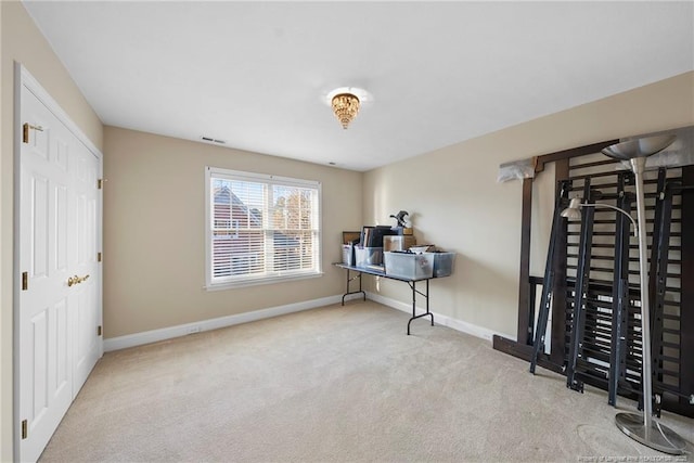 interior space featuring light colored carpet