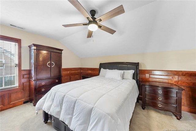 bedroom with light carpet, ceiling fan, and lofted ceiling