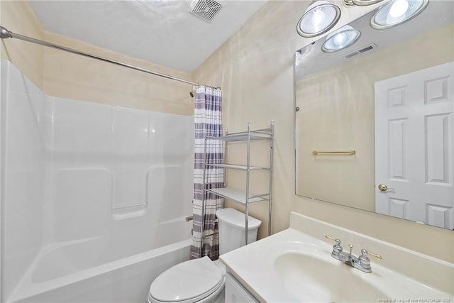 full bathroom with shower / bath combo, vanity, and toilet