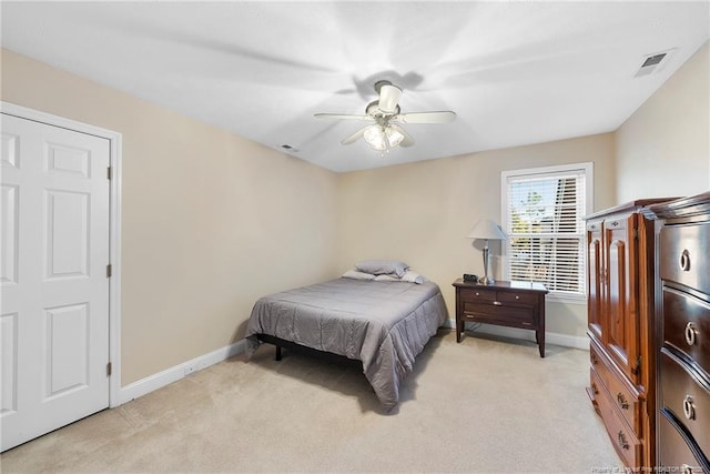 bedroom with light colored carpet and ceiling fan