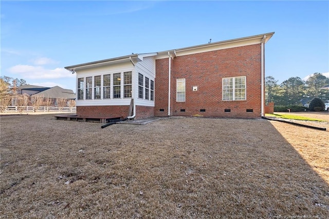 back of property featuring a sunroom