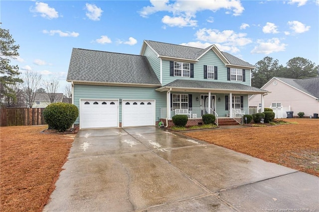 view of front of property with covered porch and a garage