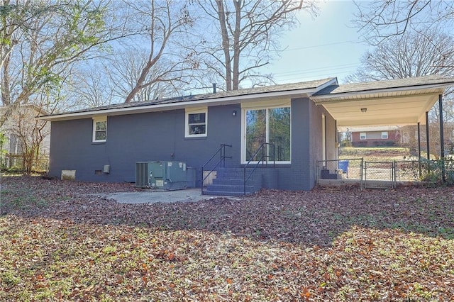 back of house featuring cooling unit