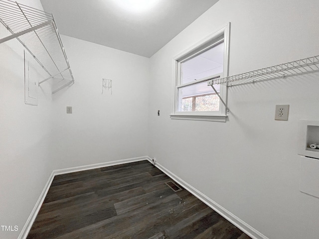 laundry room featuring hookup for an electric dryer, washer hookup, and dark hardwood / wood-style floors