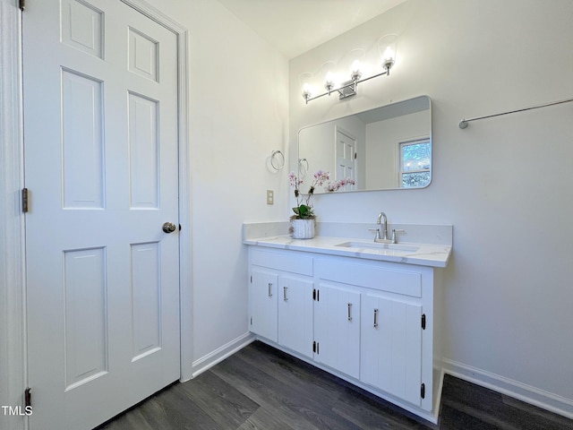 bathroom with vanity and hardwood / wood-style floors