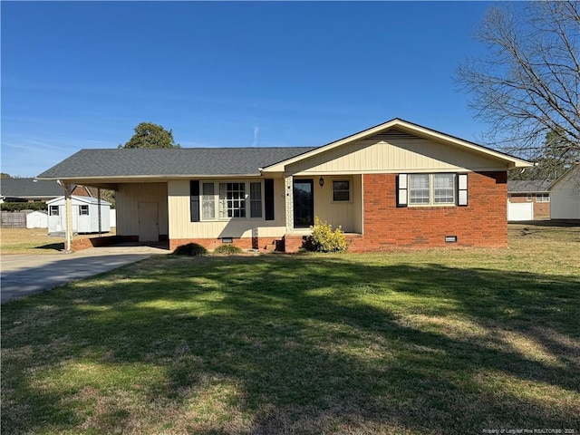 ranch-style house featuring a front yard and a carport