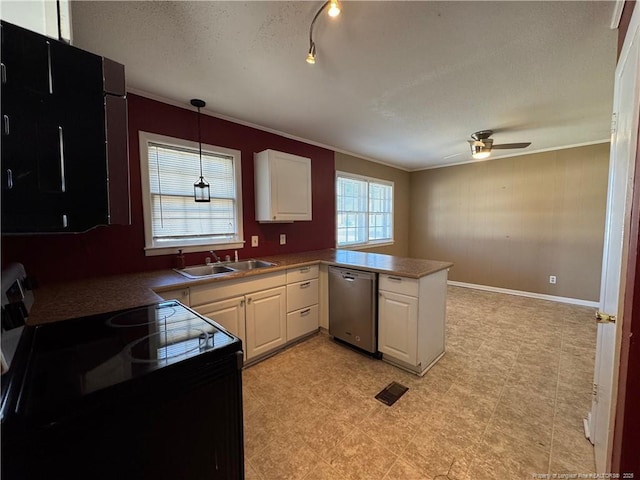 kitchen featuring white cabinetry, sink, stainless steel dishwasher, and kitchen peninsula