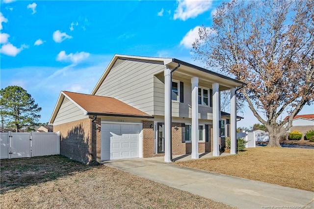 view of front facade with a front lawn and a garage