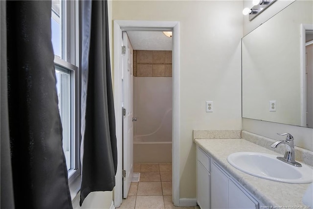 bathroom with tile patterned floors, vanity, and  shower combination