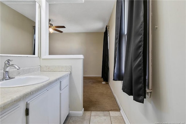 bathroom featuring tile patterned floors, vanity, and ceiling fan